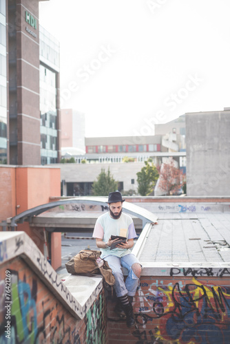 young handsome hipster gay modern man using tablet © Eugenio Marongiu