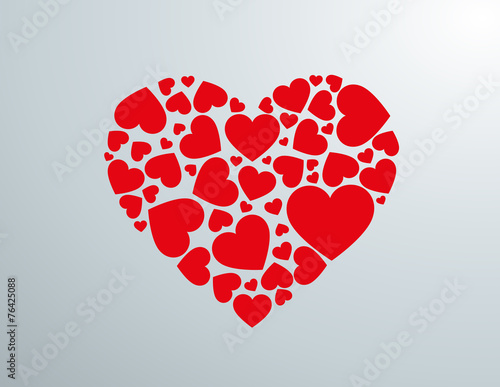 Silueta de corazón creada con corazones rojos.