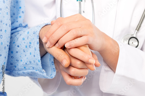Holing senior patient's hands