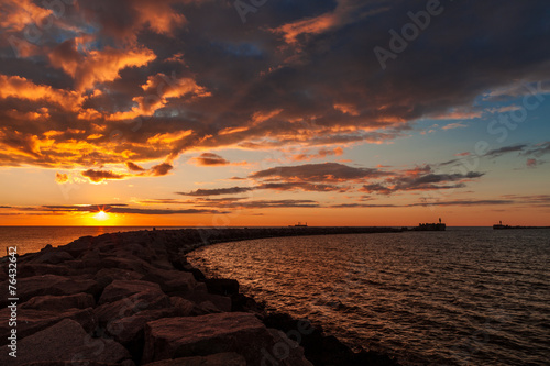 Sunset over breakwater