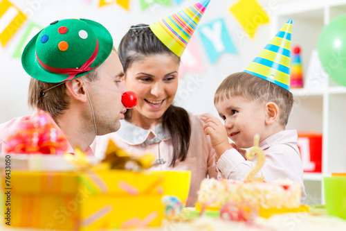 family play game celebrating child birthday