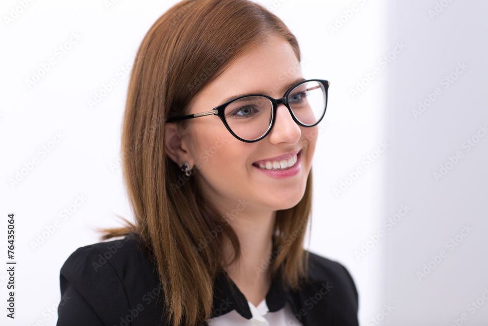 Portrait of a beautiful smiling business woman in glasses Portrait of a beautiful smiling business woman in glasses