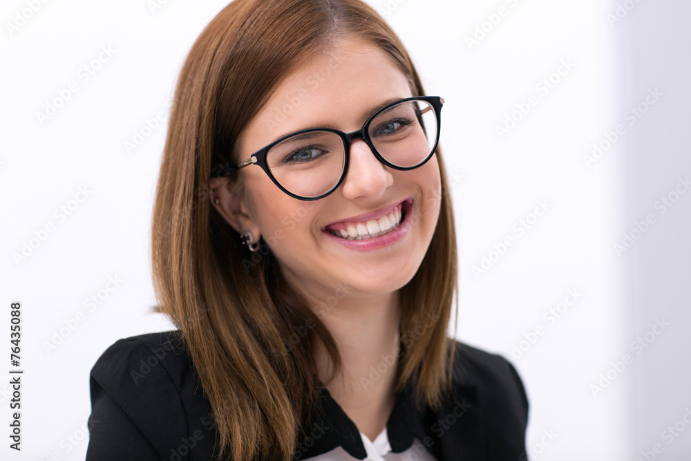 Closeup portrait of a young businesswoman in glasses