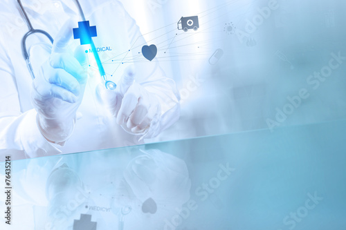 Medicine doctor hand working with modern computer interface as m