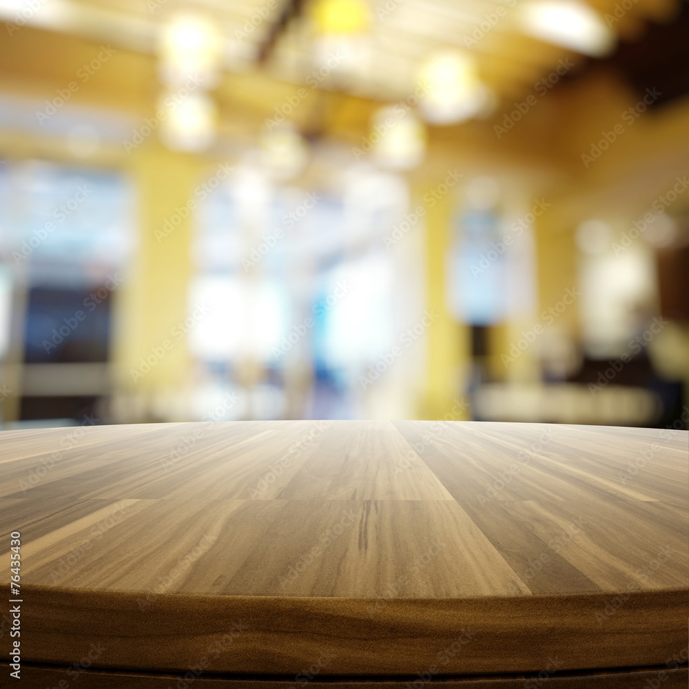 Fototapeta premium Empty wooden round table and blurred background for product pres