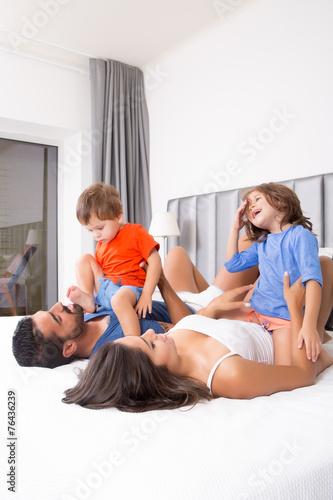 Family on bed
