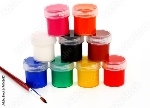 paints of different colors and slim paintbrush (brush)