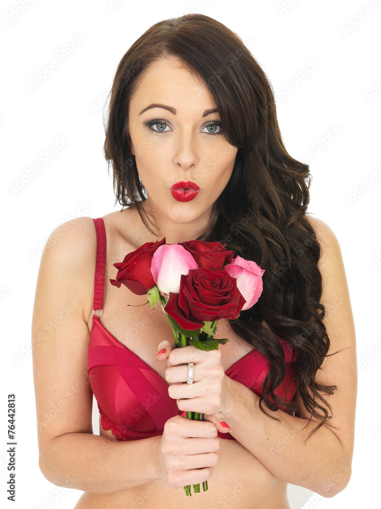 Sexy Young Woman Wearing Red Lingerie and Holding Red Roses