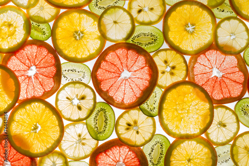 Fototapeta Naklejka Na Ścianę i Meble -  Transparency sliced fruits on white background