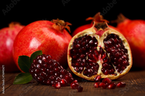 Grenadine fruits and seeds on wooden table