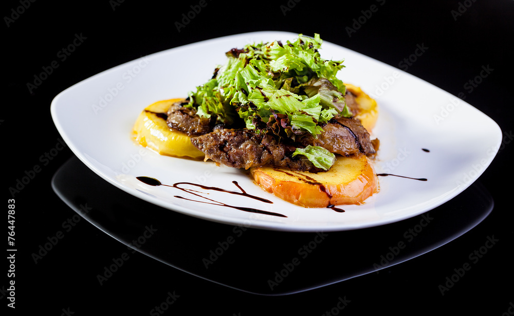 Roasted meat with fried apples.