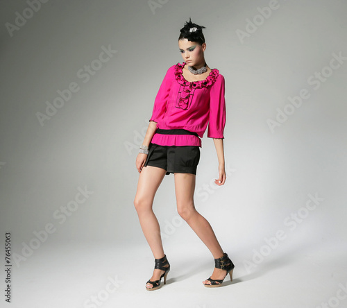 Full body fashion or casual woman portrait in red dress posing