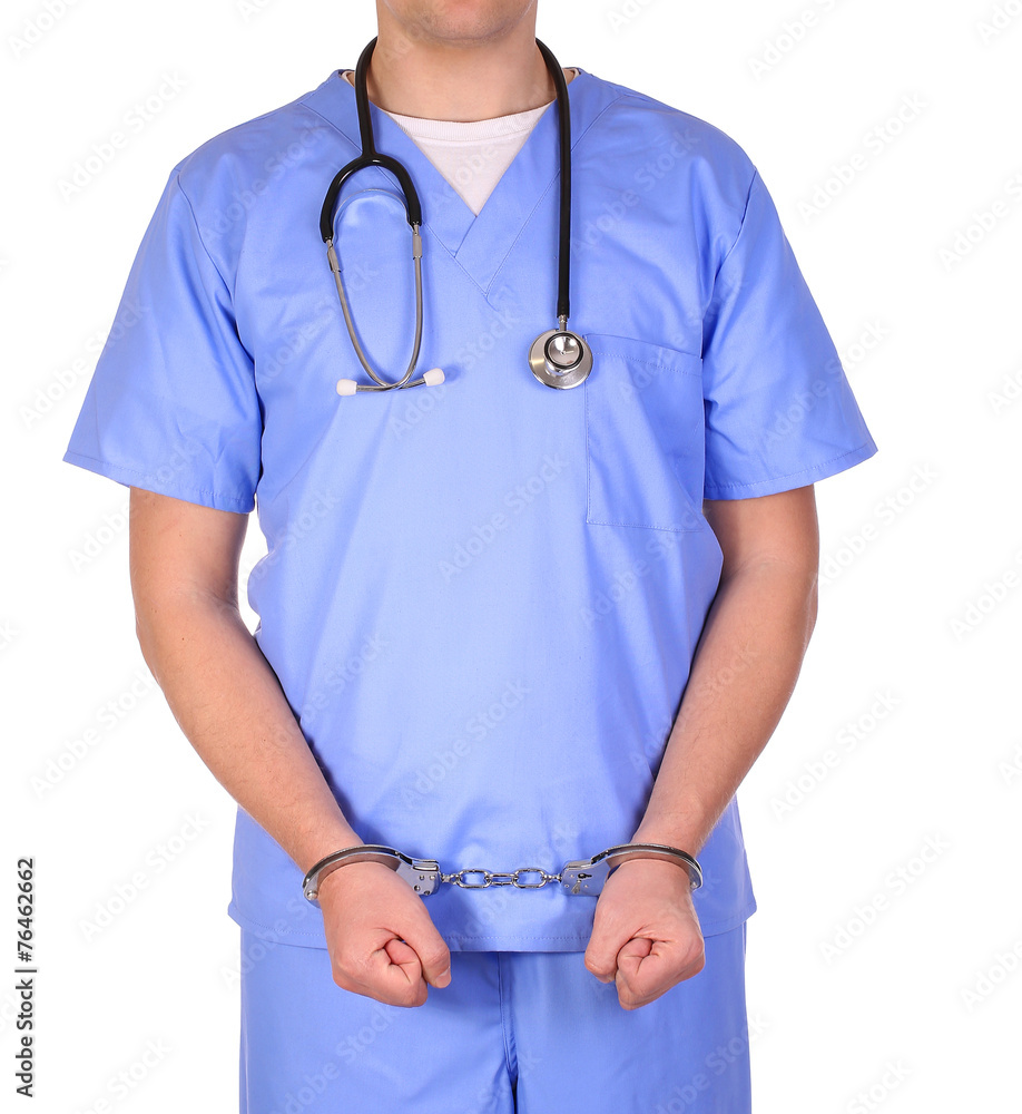 Doctor with stethoscope in handcuffs isolated on white Doctor with stethoscope in handcuffs isolated on white