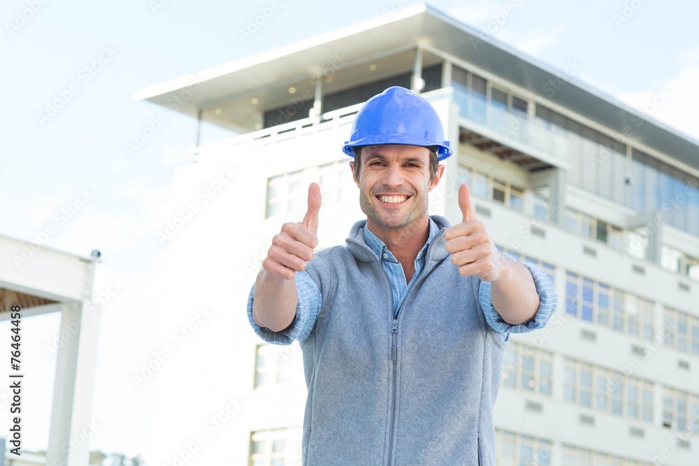 Confident male architect showing double thumbs up