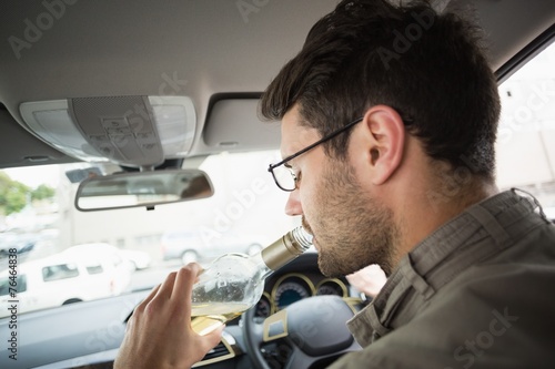 Man drinking wine while driving © WavebreakMediaMicro