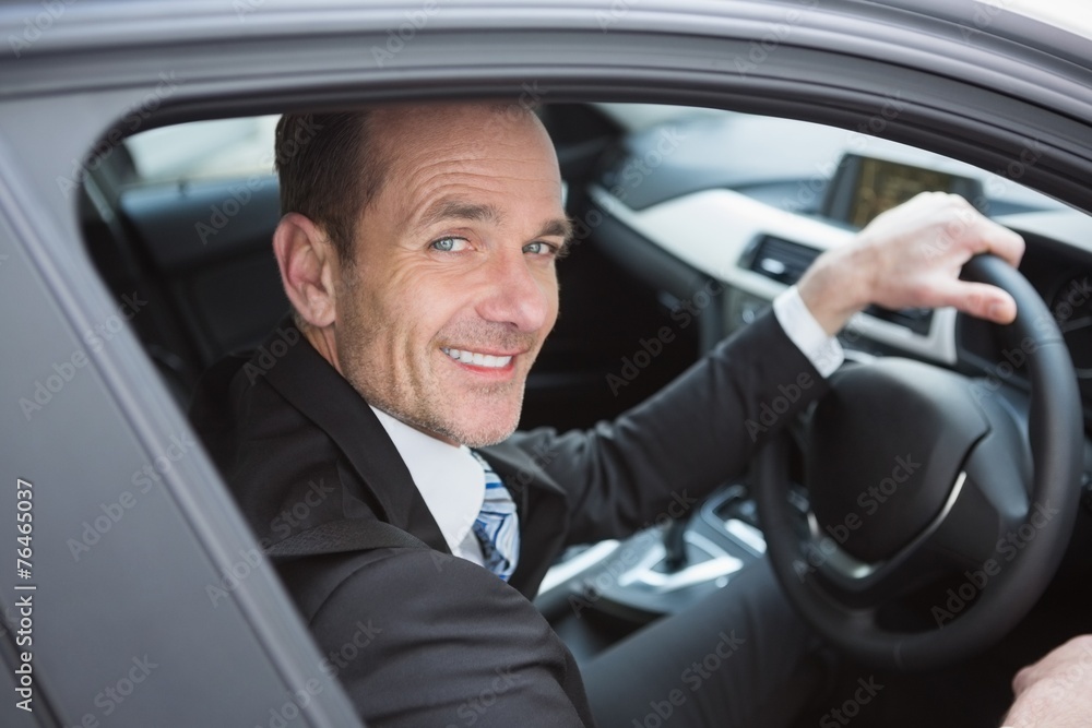 Handsome businessman smiling at camera Handsome businessman smiling at camera