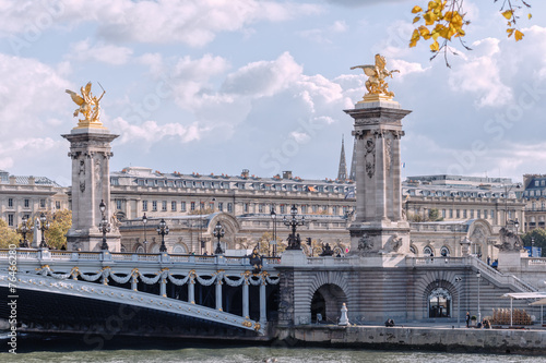 Paris, bridge Alexandre III, the Pegasus on a background cloudy