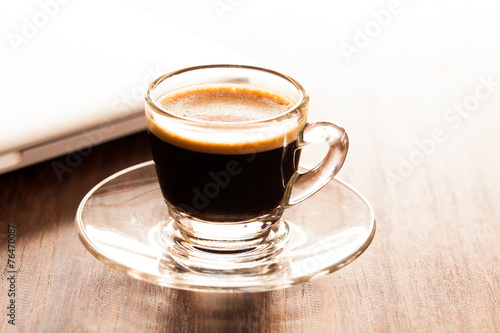 Fototapeta Naklejka Na Ścianę i Meble -  cup of espresso on a wooden background table.