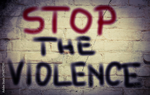 Stop the violence written on brick wall