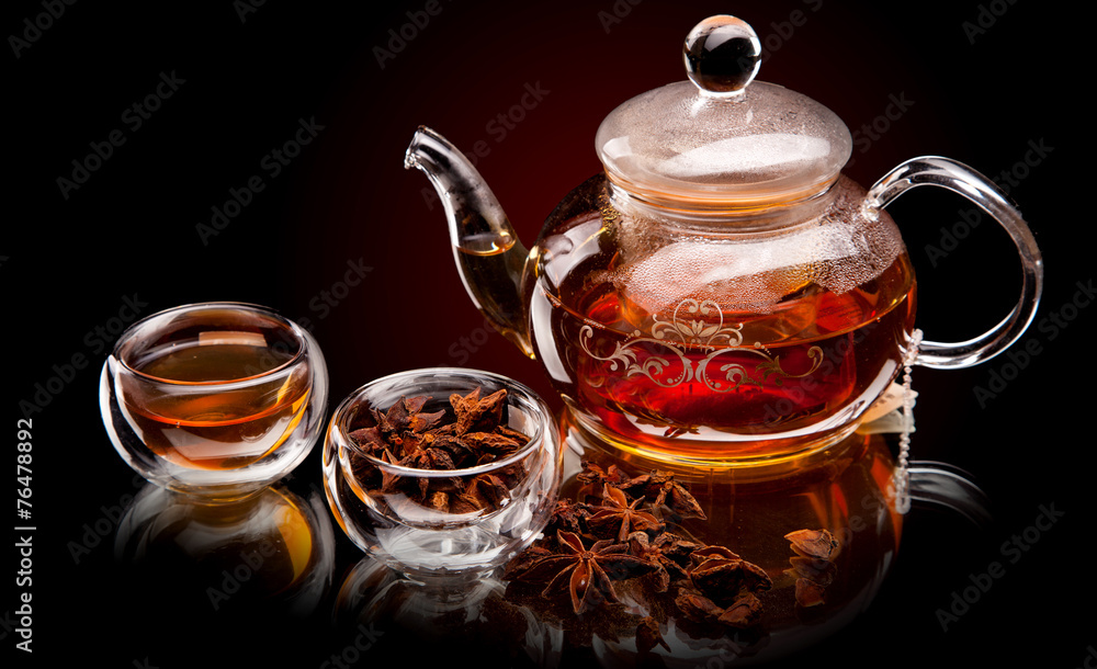 Cup of tea with teapot. With lemon and star anise Cup of tea with teapot. With lemon and star anise