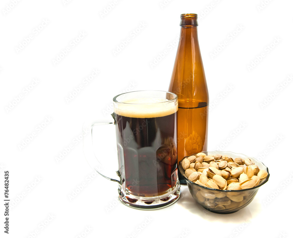 dark beer and pistachios on white dark beer and pistachios on white