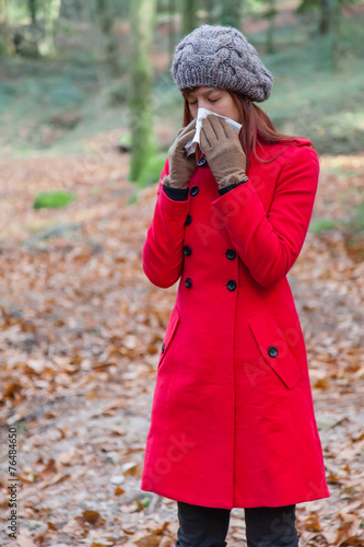 Young woman suffering from a cold or flu