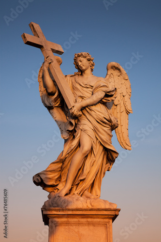 Bernini's angel at sunset along the Holy Angel bridge in Rome