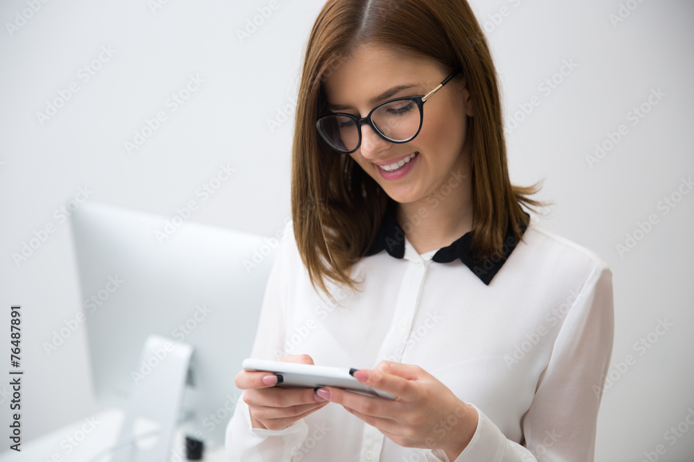 Portrait of beautiful businesswoman using smartphone