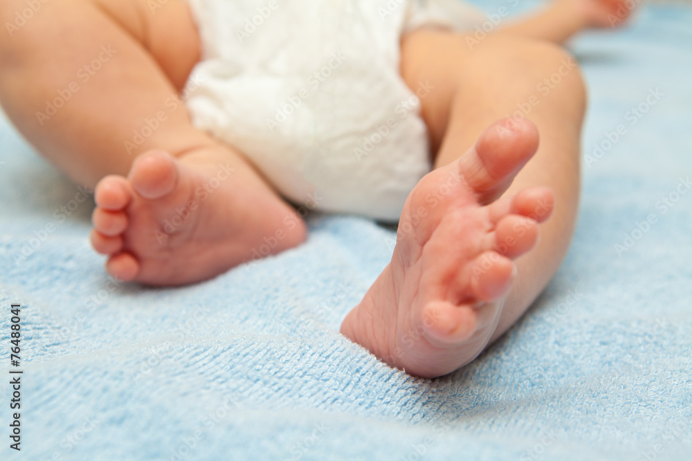 Newborn baby feet shown in close up Newborn baby feet shown in close up