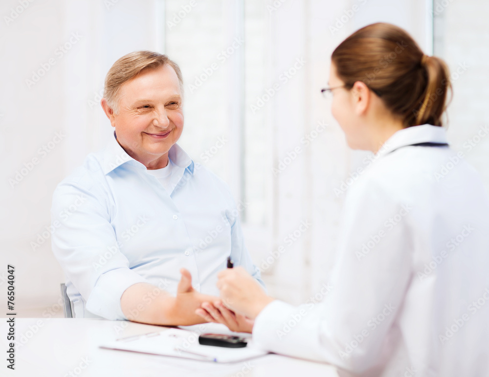 female doctor or nurse measuring blood sugar value female doctor or nurse measuring blood sugar value