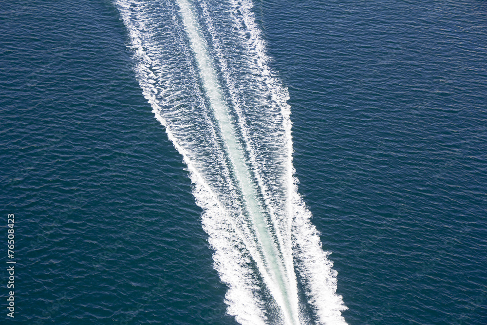 Fototapeta premium Speed boats trace on the blue sea