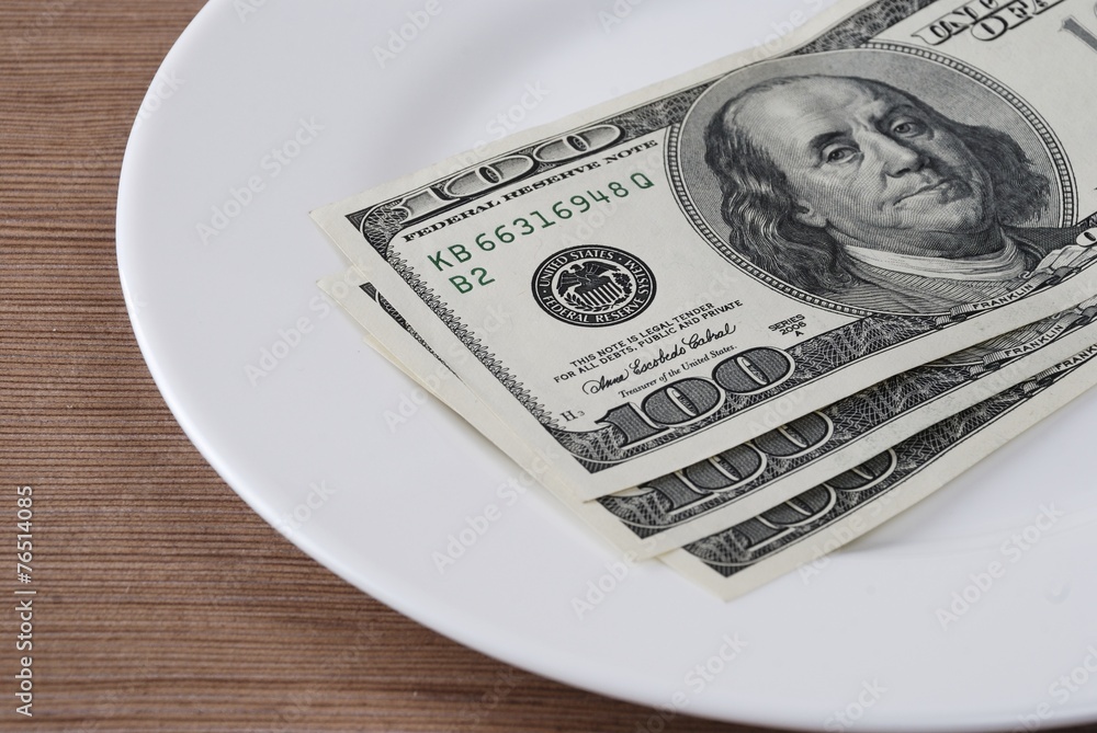Dollar bank note money in the white plate