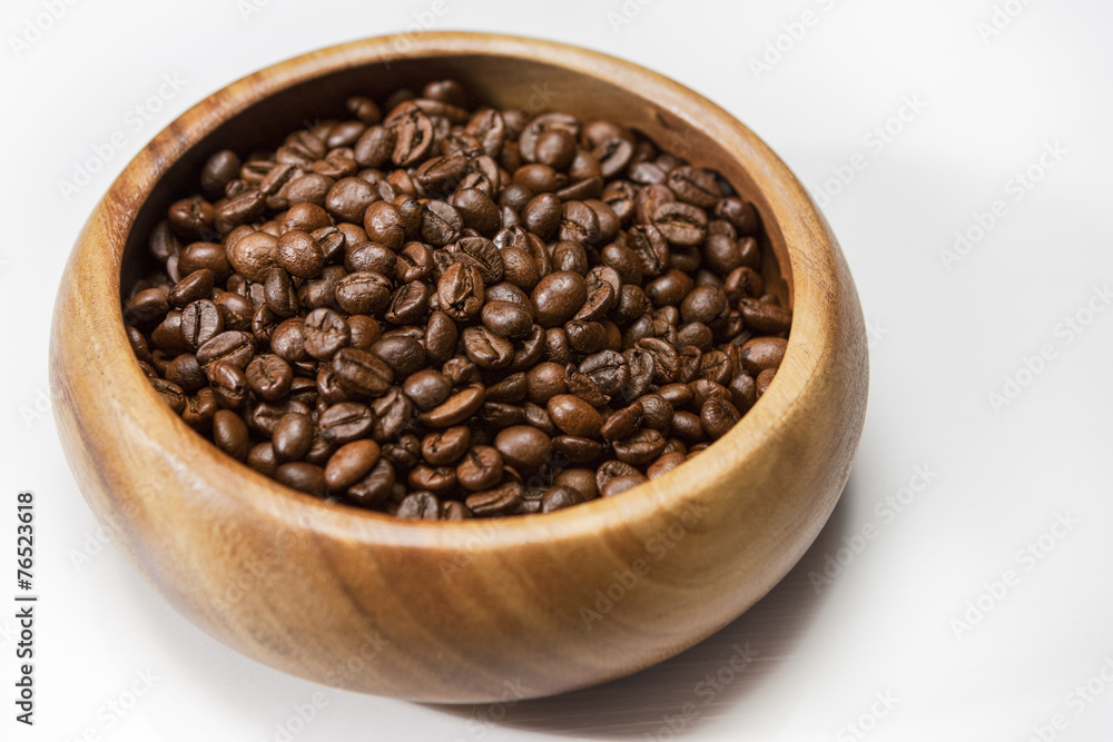 Heap of Roasted Aromatic Coffee Beans Placed in Wooden Bowl over