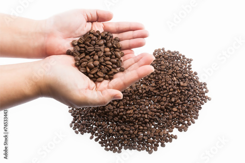 coffee grains on the hands © maewjpho