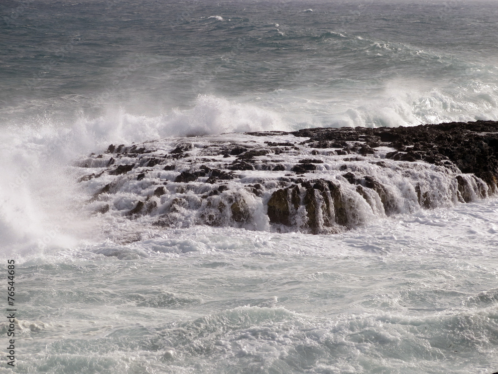 rock covered by the waves of the sea where ships can wrecked rock covered by the waves of the sea where ships can wrecked