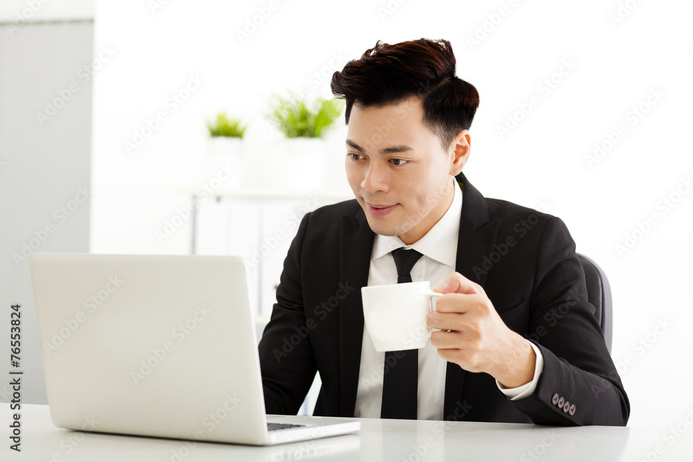 Young business man working in the office Young business man working in the office