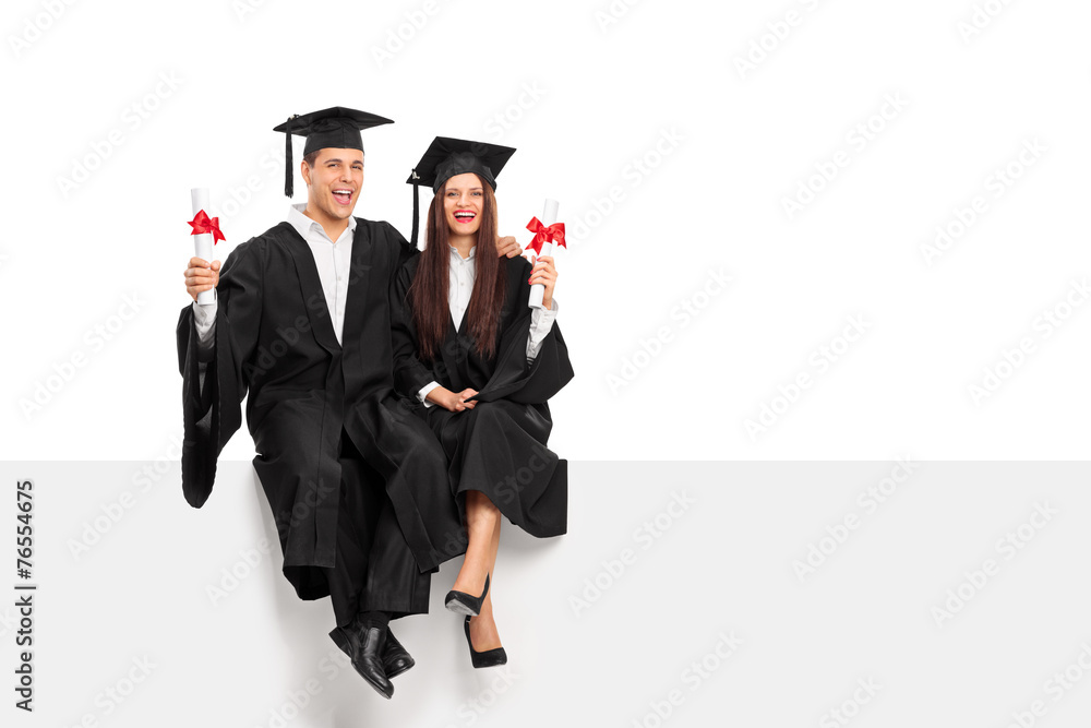 Couple holding diplomas and celebrating graduation Couple holding diplomas and celebrating graduation