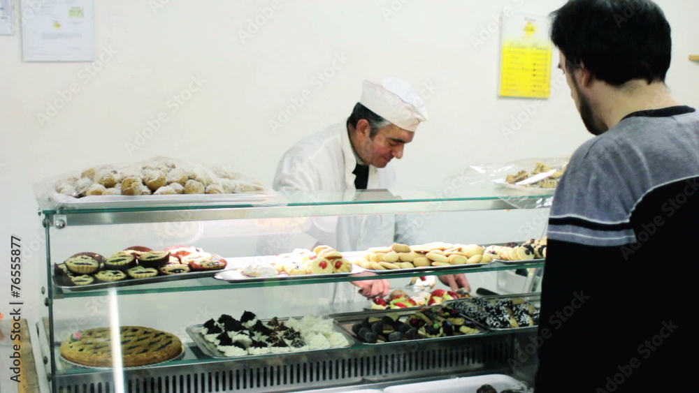 baker sells pastries to a customer baker sells pastries to a customer