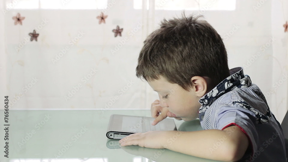 beautiful child writes with the tablet beautiful child writes with the tablet