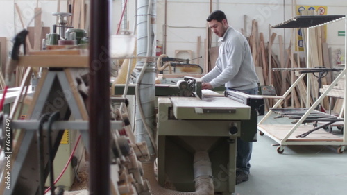 carpenter creating a forniture - dolly photo