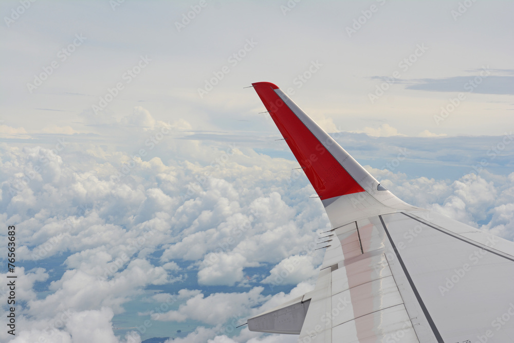 aircraft wing on the cloud during flight