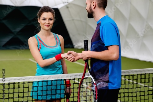 Woman tennis player shaking hand with her coach © Nejron Photo