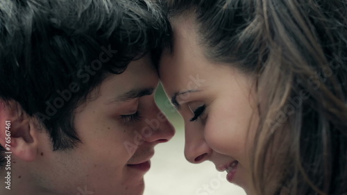 fall in love,lovers smiling, caressing and rubbing noses together