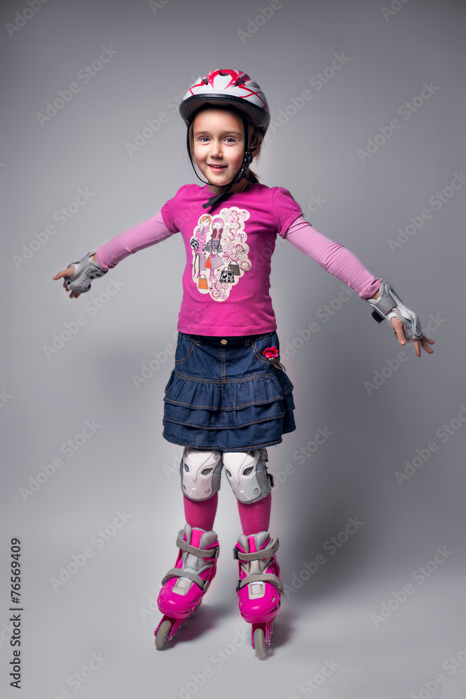 Portrait of emotional sports  kid with roller skate