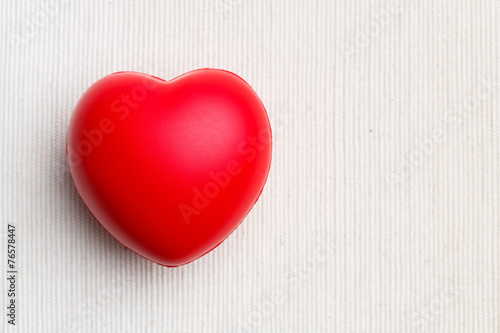 Red heart on cloth background