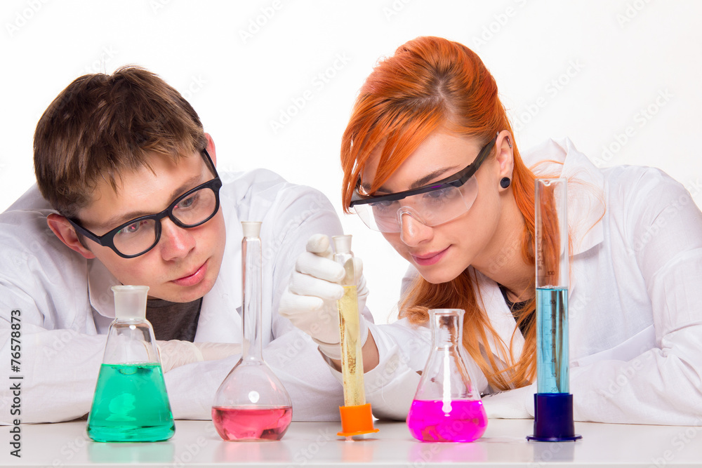 Two students in chemistry lab doing reactions Two students in chemistry lab doing reactions
