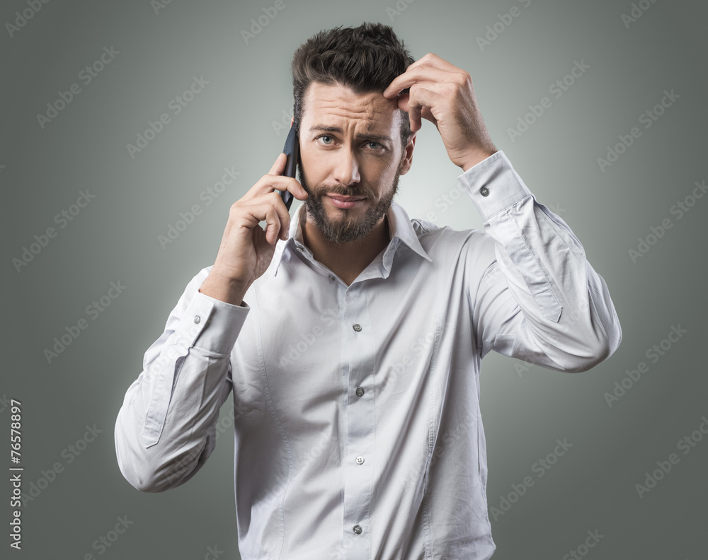 Disappointed man on the phone Disappointed man on the phone