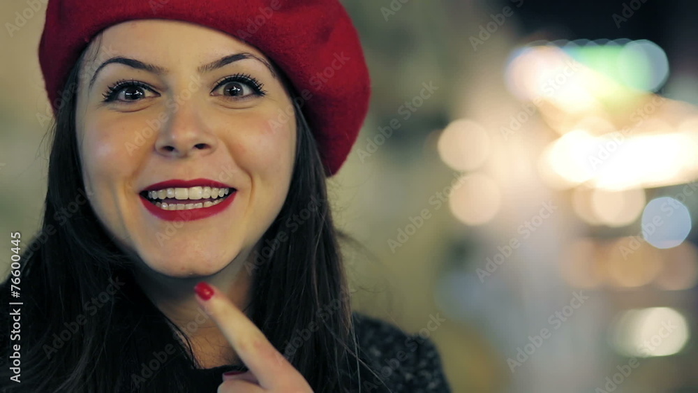 smiling young woman looks into the camera and jokes smiling young woman looks into the camera and jokes