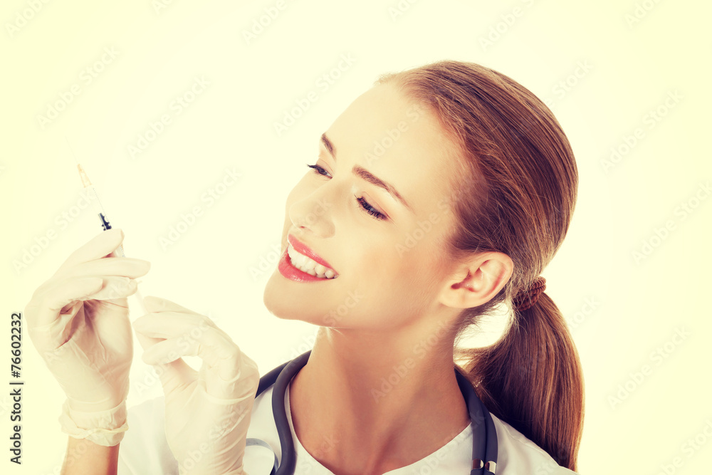 Beautiful young nurse or doctor with needle. Beautiful young nurse or doctor with needle.