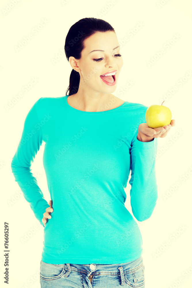 Beautiful woman holding an apple. Beautiful woman holding an apple.
